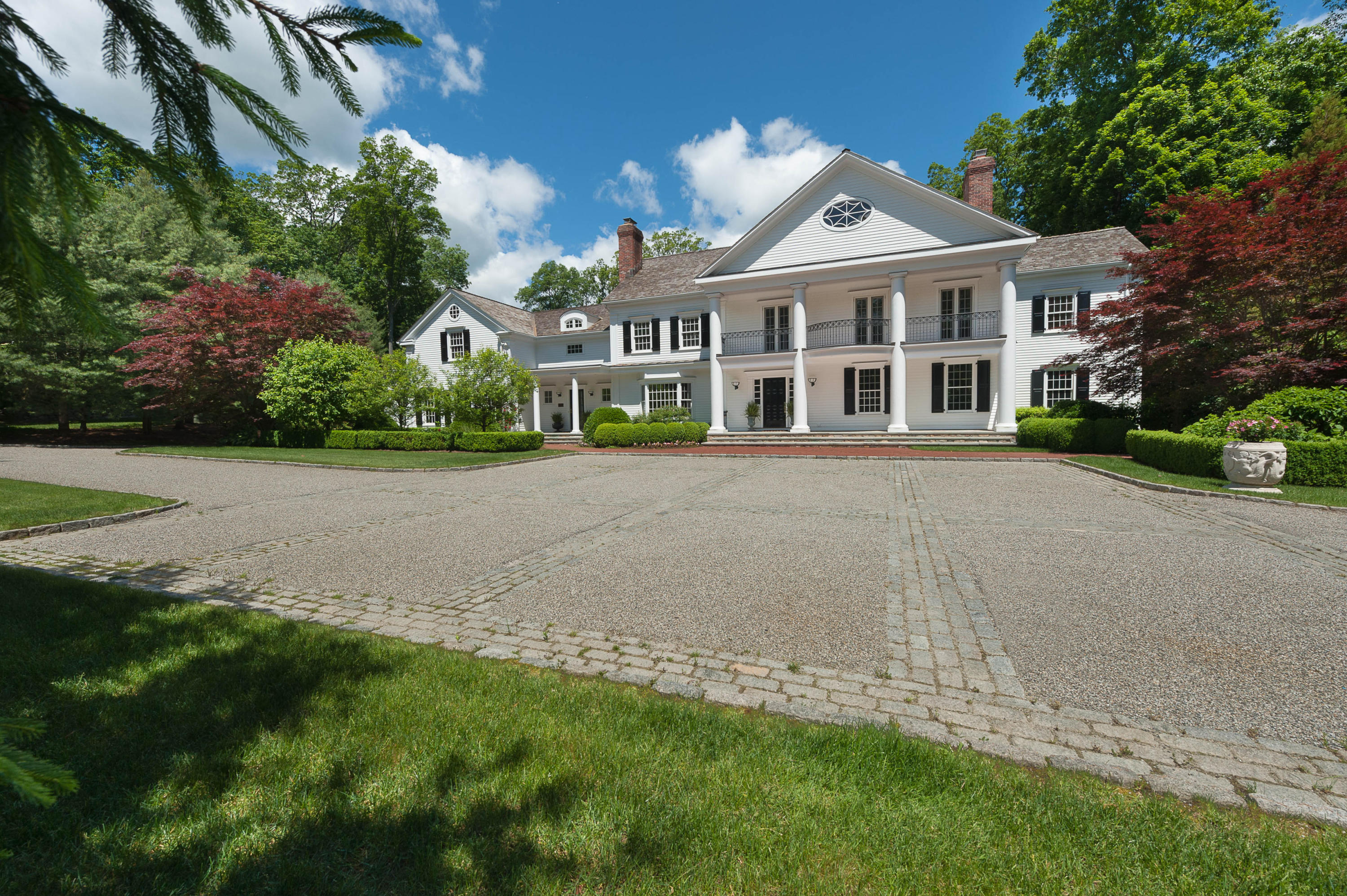 399 Wahackme Road New Canaan, CT 06840 - Photo 35 of 35 a front view of a house with a garden