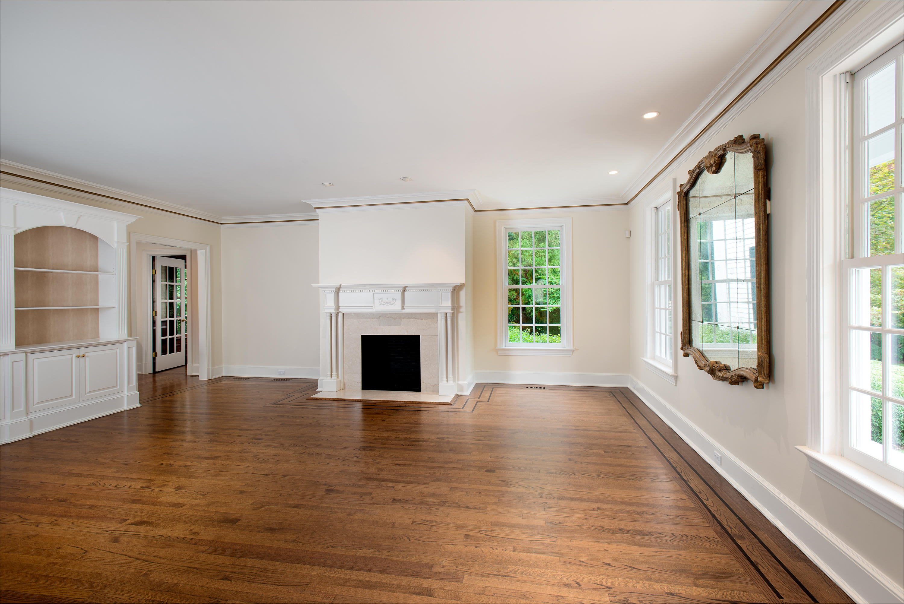 399 Wahackme Road New Canaan, CT 06840 - Photo 7 of 35 an empty room with windows and fireplace