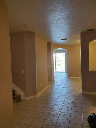 a view of hallway with a window