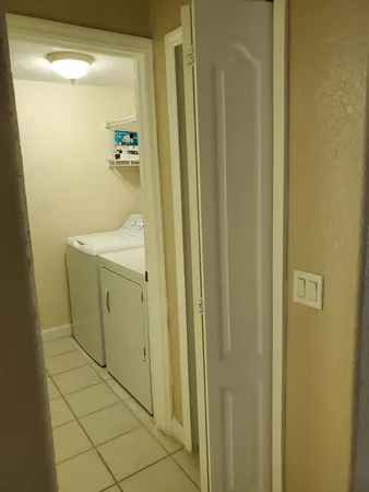 a bathroom with a shower and a sink