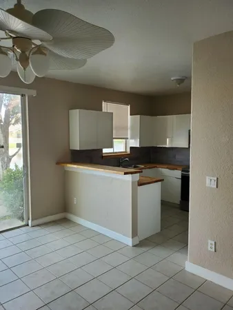 a kitchen with stainless steel appliances granite countertop a sink and a stove