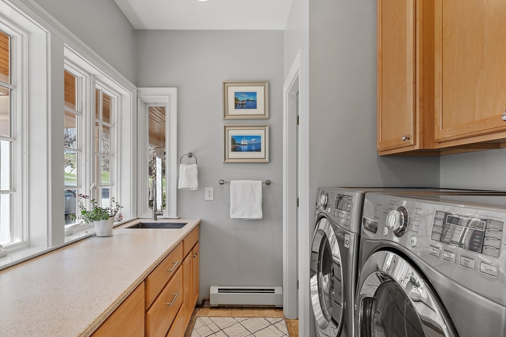 50 Castle View Drive Gloucester, MA 01930 - Photo 13 of 42 a view of a kitchen with sink washer and dryer