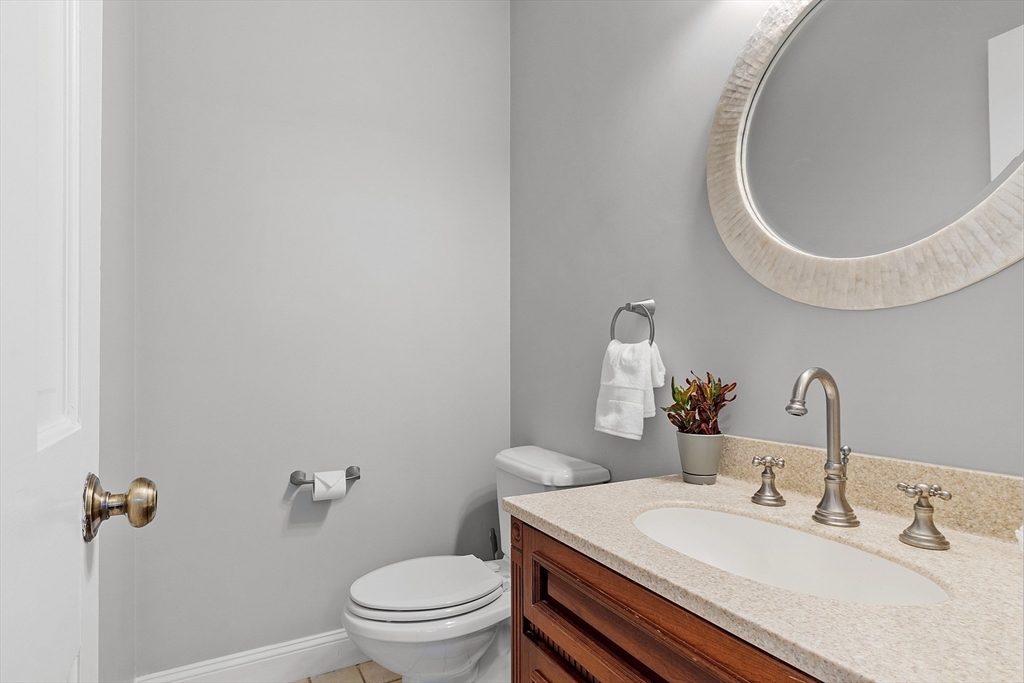 50 Castle View Drive Gloucester, MA 01930 - Photo 17 of 42 a bathroom with a sink and a mirror