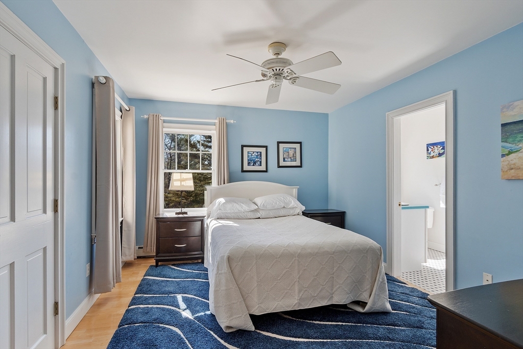 50 Castle View Drive Gloucester, MA 01930 - Photo 31 of 42 a bedroom with a bed and wooden floor