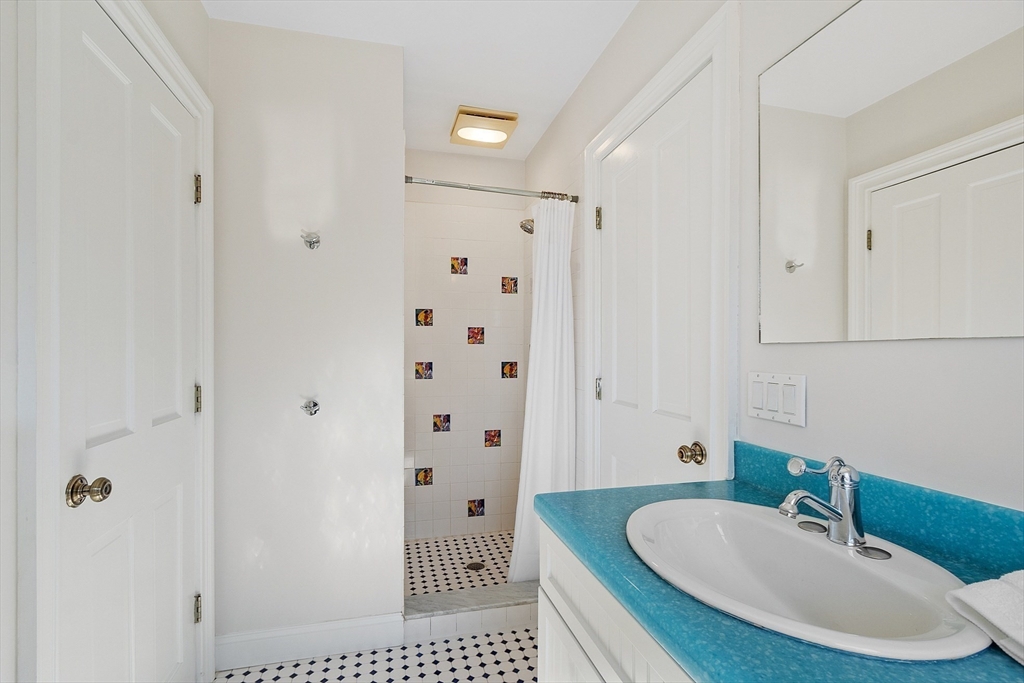 50 Castle View Drive Gloucester, MA 01930 - Photo 32 of 42 a bathroom with a sink and a mirror