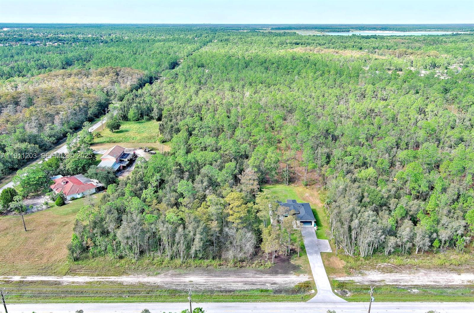 0 Everglades Boulevard North Naples, FL 34120 - Photo 7 of 16 a view of a yard with an outdoor space