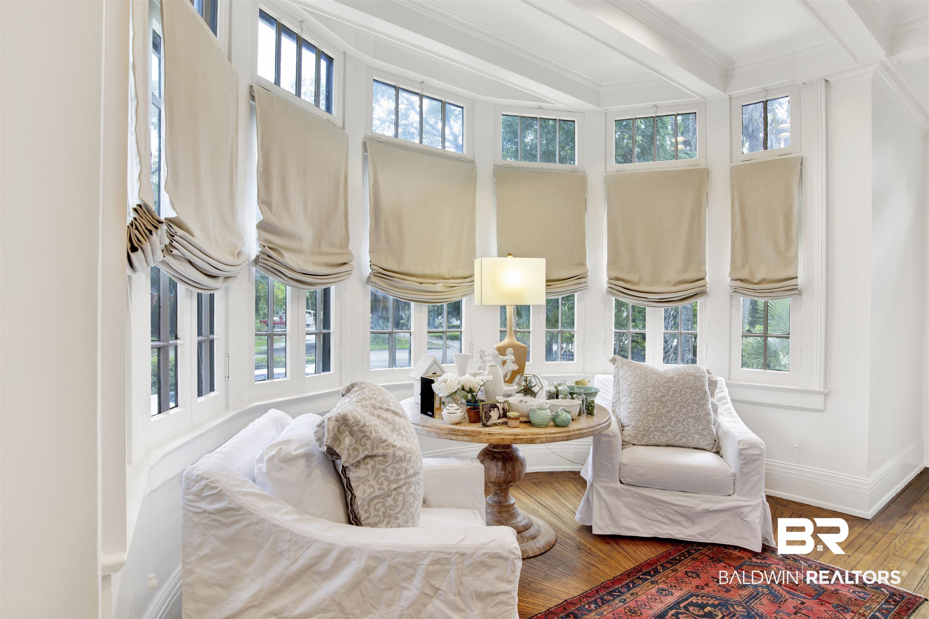 1654 Government Street Mobile, AL 36604 - Photo 13 of 45 Sitting room featuring beamed ceiling, ornamental molding, a wealth of natural light, and hardwood / wood-style flooring