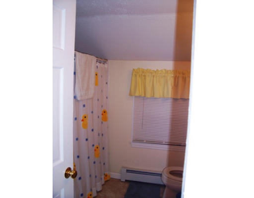 705 Wheeler Road Dracut, MA 01826 - Photo 11 of 11 a bathroom with a shower