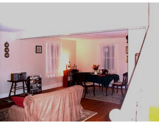 705 Wheeler Road Dracut, MA 01826 - Photo 6 of 11 a dining room with furniture and wooden floor
