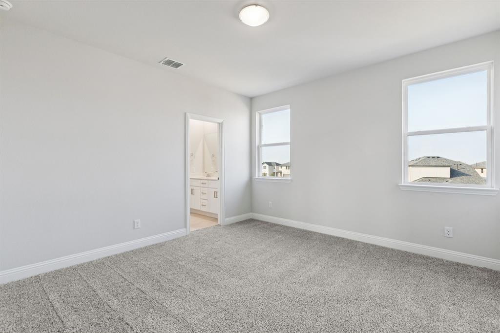 1318 Middlebrook Drive Forney, TX 75126 - Photo 11 of 39 an empty room with windows and closet