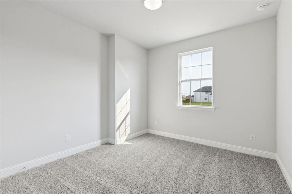 1318 Middlebrook Drive Forney, TX 75126 - Photo 16 of 39 an empty room with windows