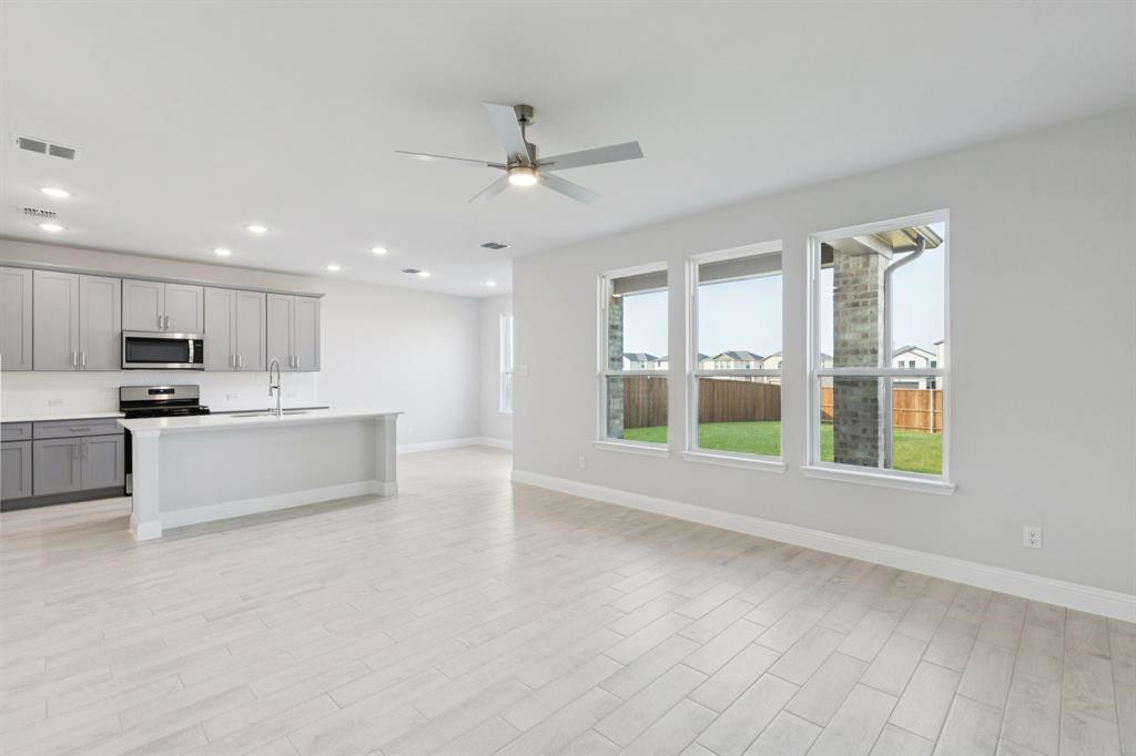 1318 Middlebrook Drive Forney, TX 75126 - Photo 7 of 39 a view of kitchen with stainless steel appliances refrigerator oven and cabinets