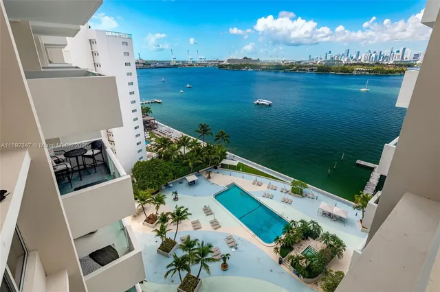 an aerial view of house with yard swimming pool and outdoor seating