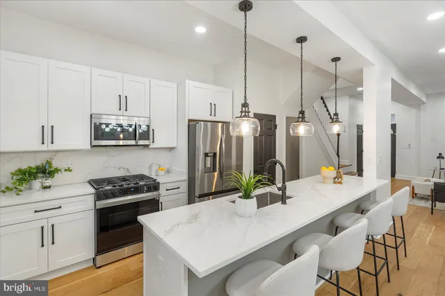 a kitchen with a table and chairs in it