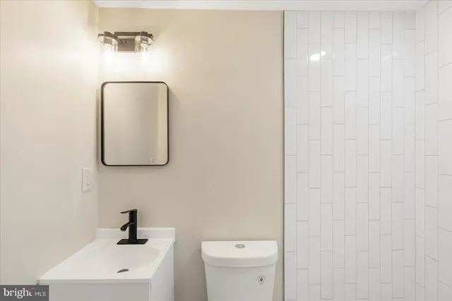 a bathroom with a toilet and a sink
