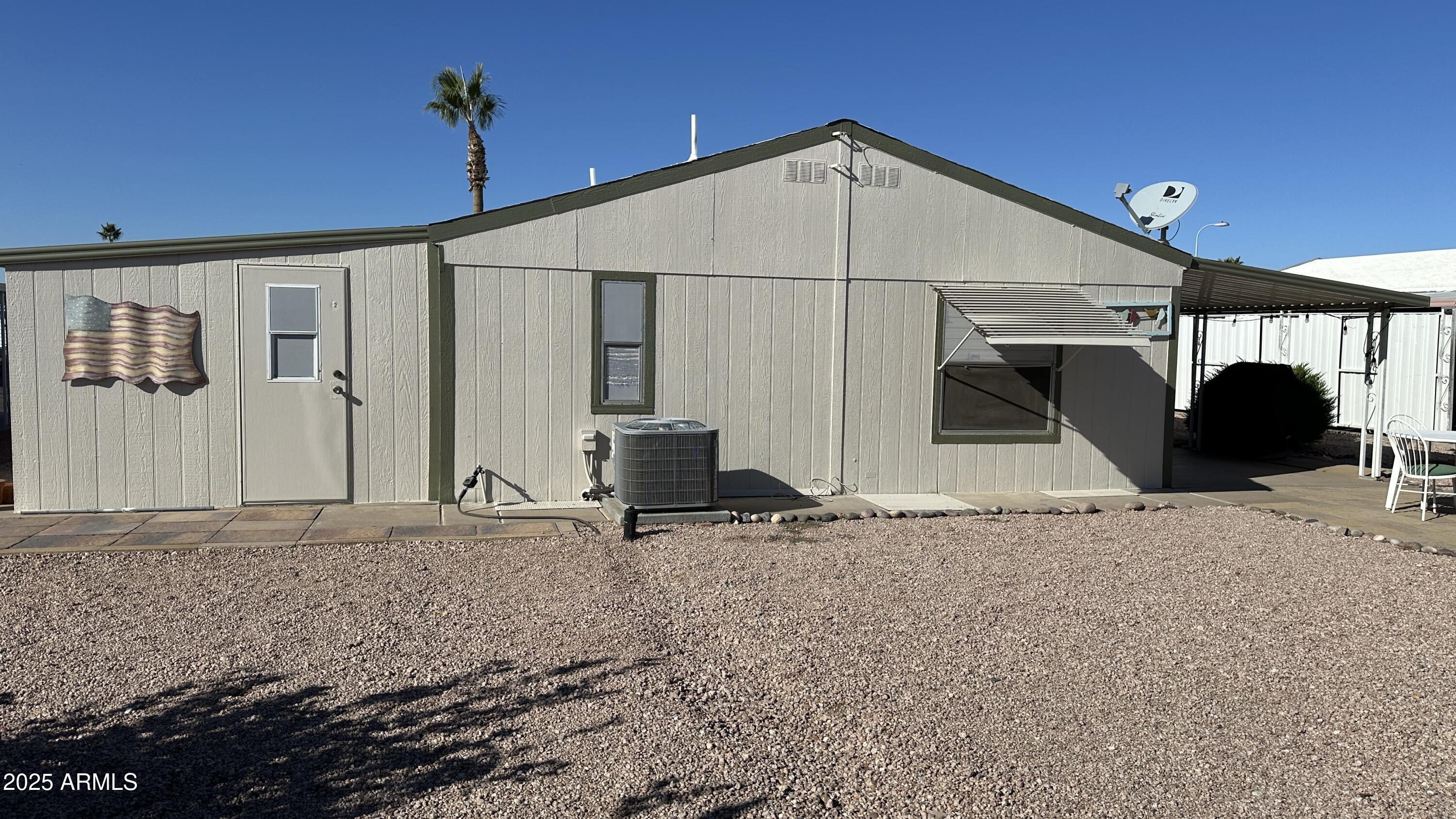 834 South Meridian Road, Unit 105 Apache Junction, AZ 85120 - Photo 30 of 48 a view of a house with a roof