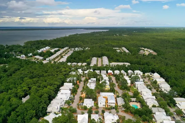 an aerial view of a house with outdoor space and a garden