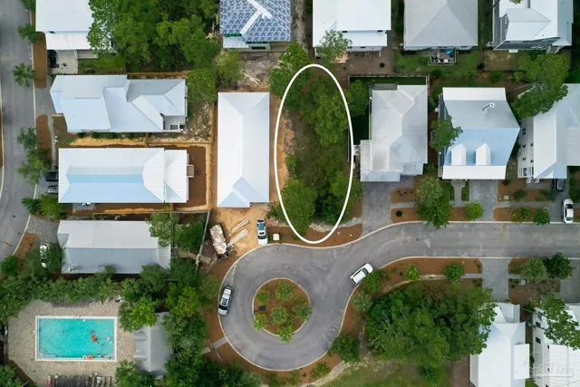 an aerial view of a house with swimming pool and outdoor space