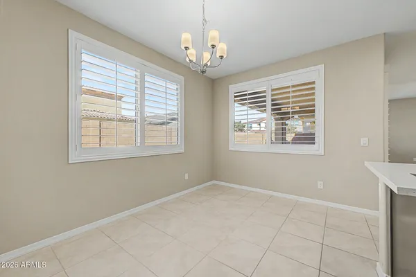 a view of an empty room with windows