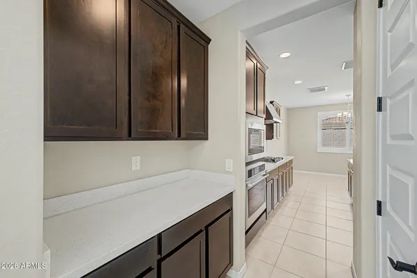 a kitchen with a sink and a refrigerator