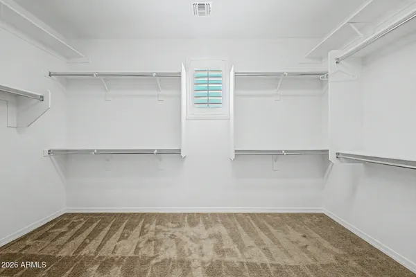 a view of an empty walk in closet