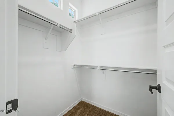 a view of a room with a ceiling fan