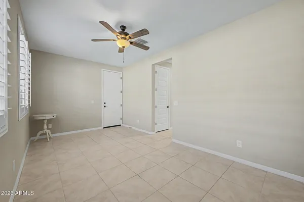 a bathroom with a sink a toilet a mirror and shower