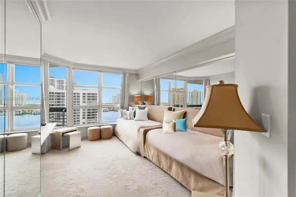 a bathroom with a sink vanity mirror and toilet