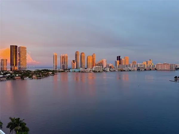 a view of a ocean with tall building