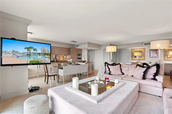 a large white room with a couch and a table chair