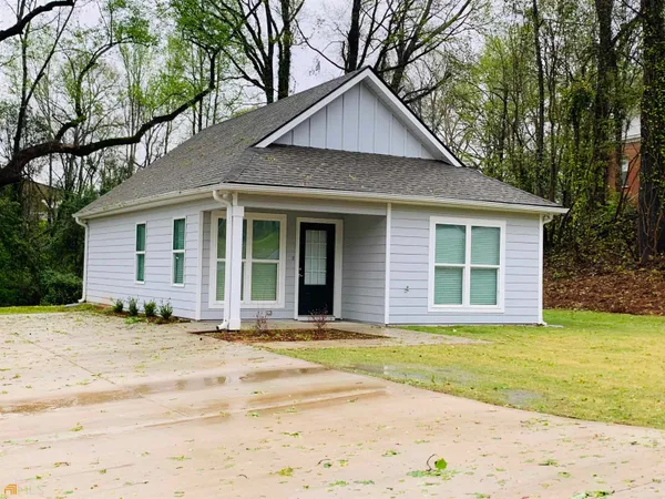 a front view of a house with a patio