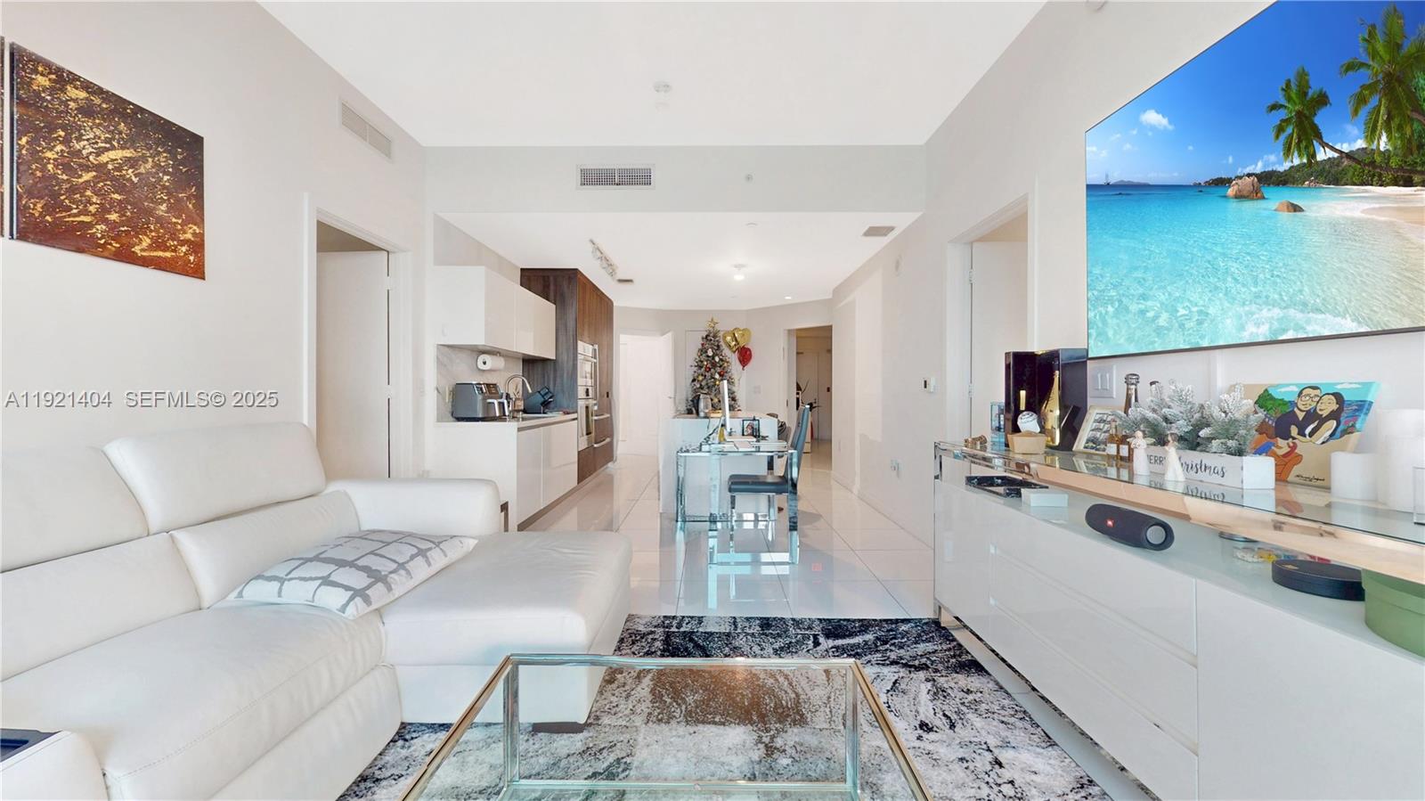 851 Northeast 1st Avenue, Unit 1508 Miami, FL 33132 - Photo 11 of 43 a living room with furniture and a flat screen tv