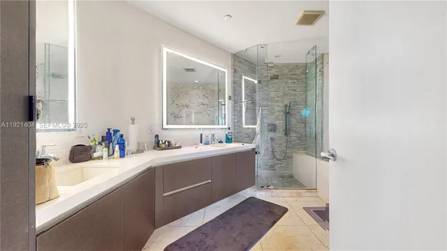 a bathroom with a tub sink toilet and a mirror