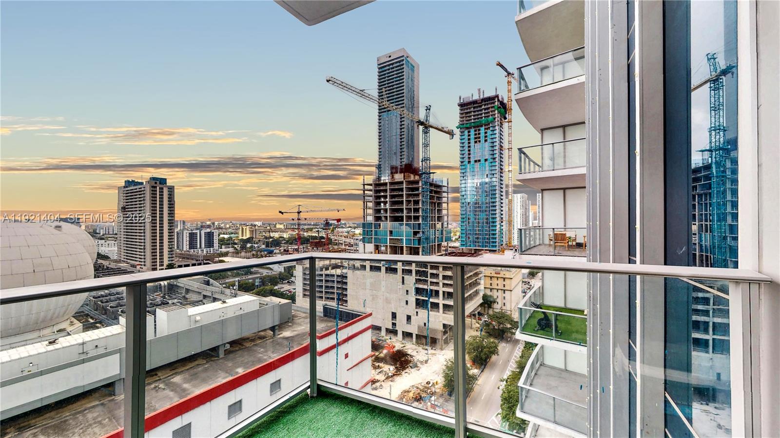 851 Northeast 1st Avenue, Unit 1508 Miami, FL 33132 - Photo 28 of 43 a view of a balcony with wooden floor and iron stairs