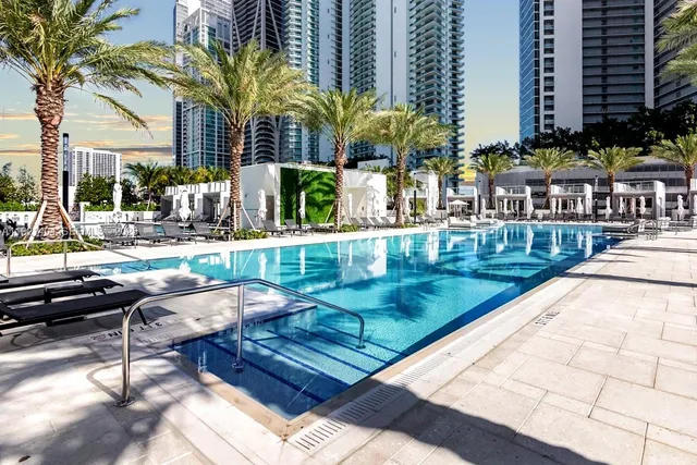 a view of a swimming pool with a lounge chair