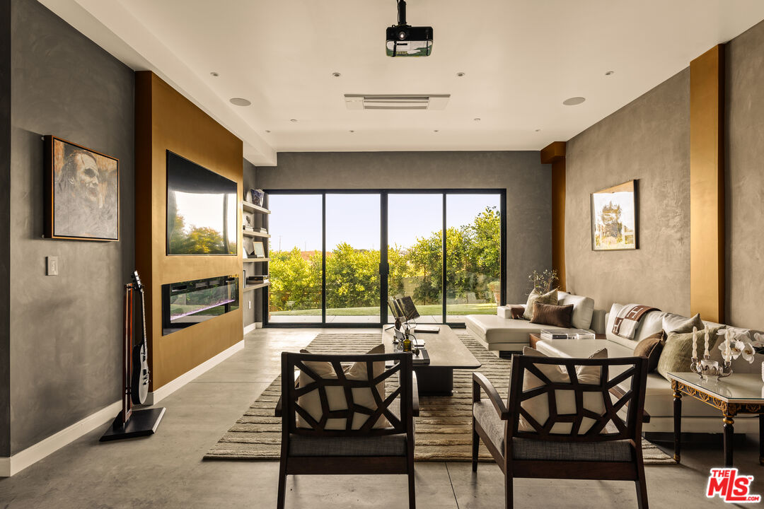 5904 Kanan Dume Road Malibu, CA 90265 - Photo 12 of 18 a view of a dining room with furniture a chandelier and wooden floor
