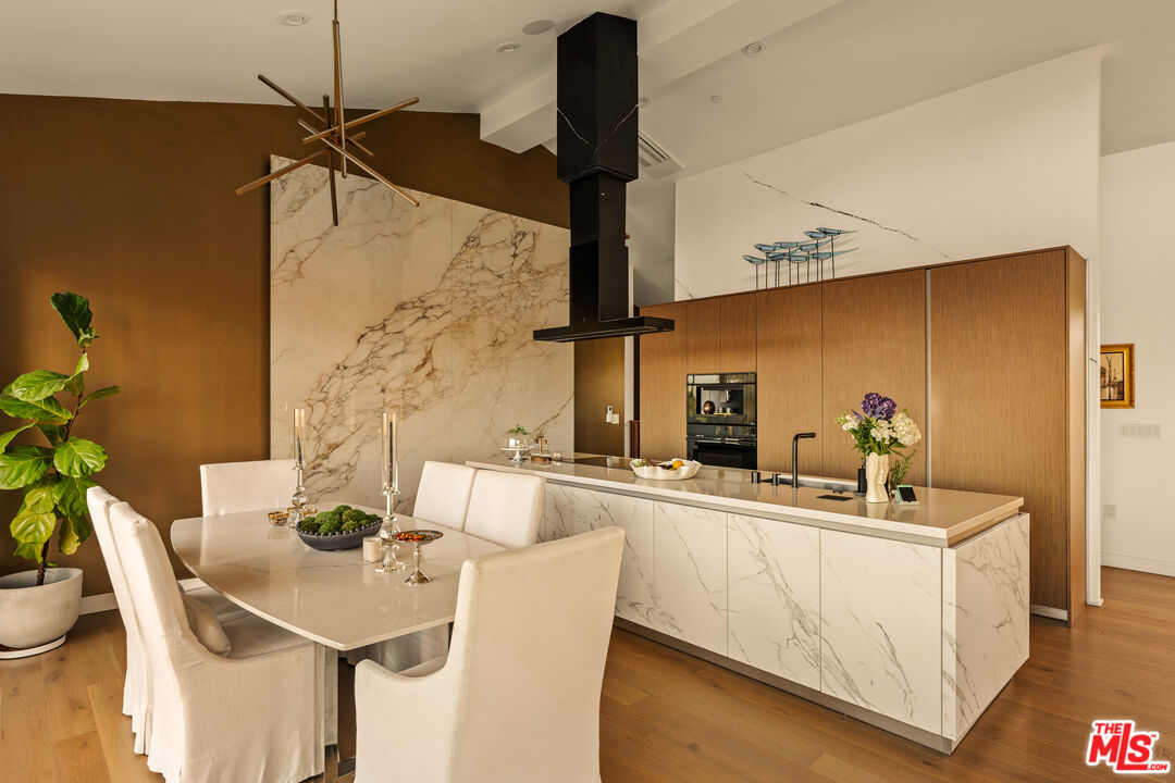 5904 Kanan Dume Road Malibu, CA 90265 - Photo 5 of 18 a kitchen with a table and chairs
