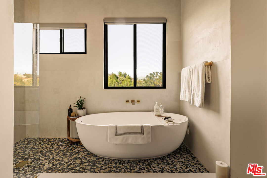 5904 Kanan Dume Road Malibu, CA 90265 - Photo 8 of 18 a white bath tub sitting next to a white sink