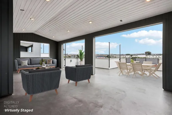 a living room with furniture a large window
