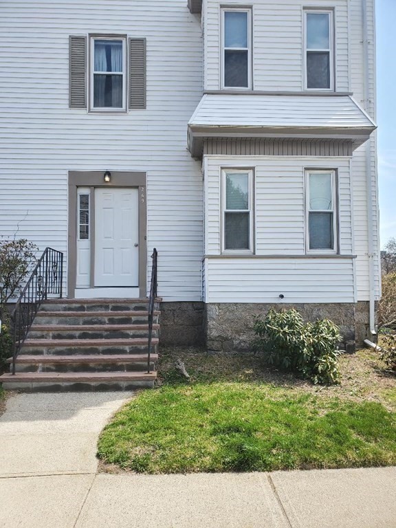 269 Stetson Street, Unit 2 Fall River, MA 02720 - Photo 10 of 12 a front view of a house with a garden
