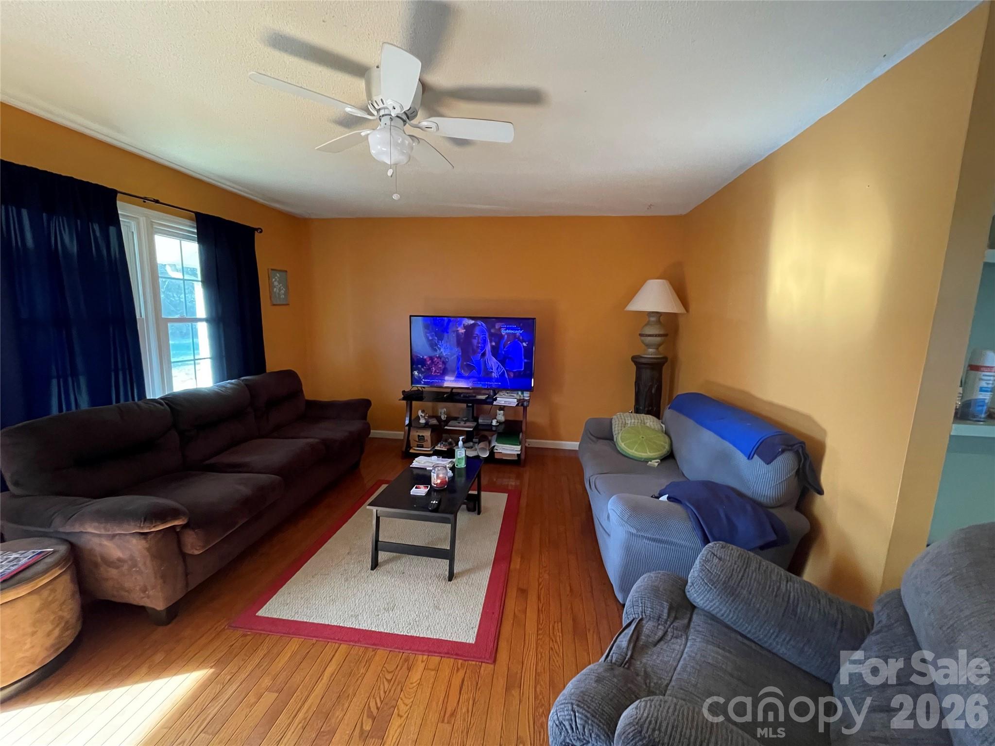 4907 Delmar Griffin Road Monroe, NC 28112 - Photo 3 of 25 a living room with furniture and a flat screen tv