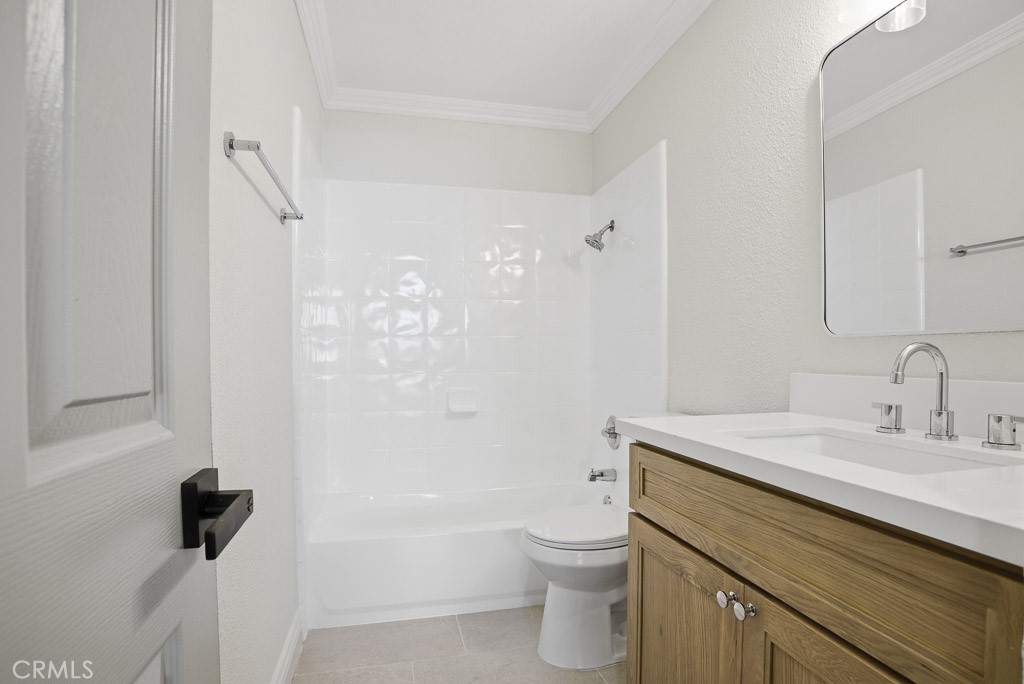 7051 Idyllwild Lane Riverside, CA 92503 - Photo 19 of 40 a bathroom with a sink a toilet and shower