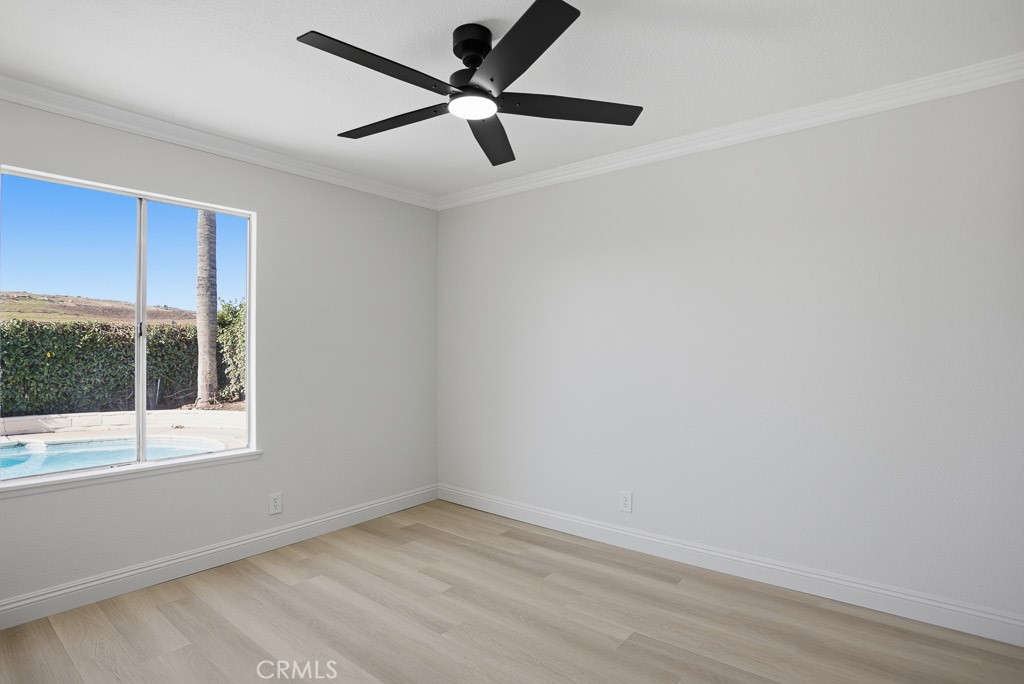 7051 Idyllwild Lane Riverside, CA 92503 - Photo 22 of 40 an empty room with a window and a fan
