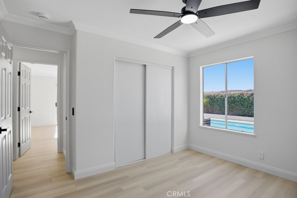 7051 Idyllwild Lane Riverside, CA 92503 - Photo 23 of 40 wooden floor in an empty room with a window