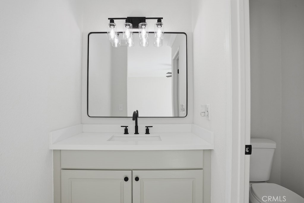 7051 Idyllwild Lane Riverside, CA 92503 - Photo 27 of 40 a bathroom with a sink and mirror