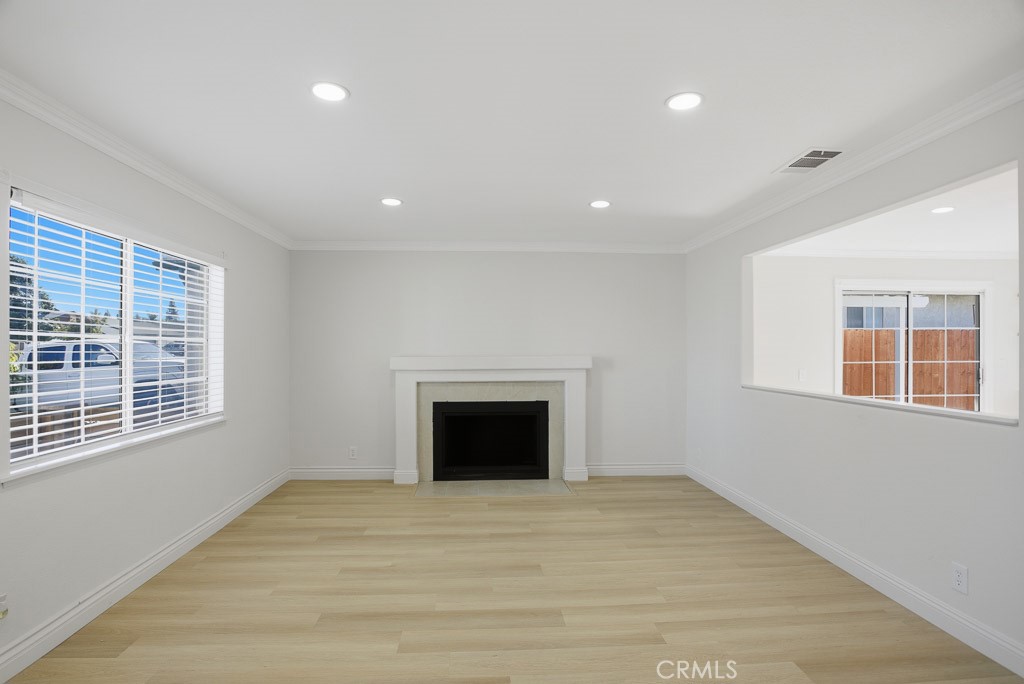 7051 Idyllwild Lane Riverside, CA 92503 - Photo 6 of 40 a view of an empty room with a window and fireplace