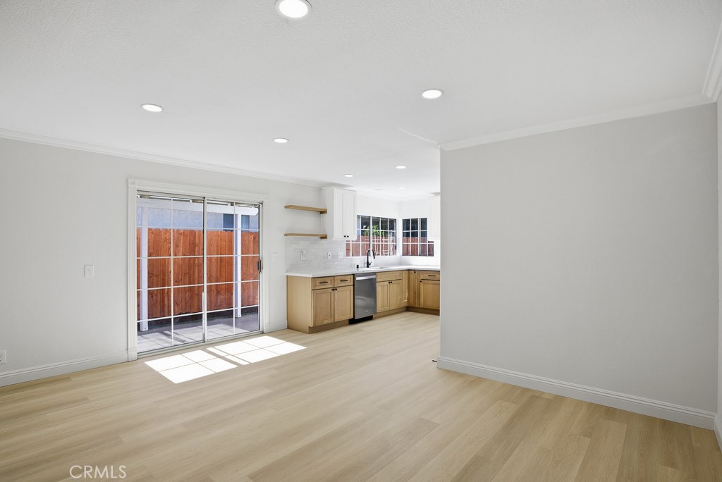 7051 Idyllwild Lane Riverside, CA 92503 - Photo 8 of 40 a view of an empty room with a window and kitchen
