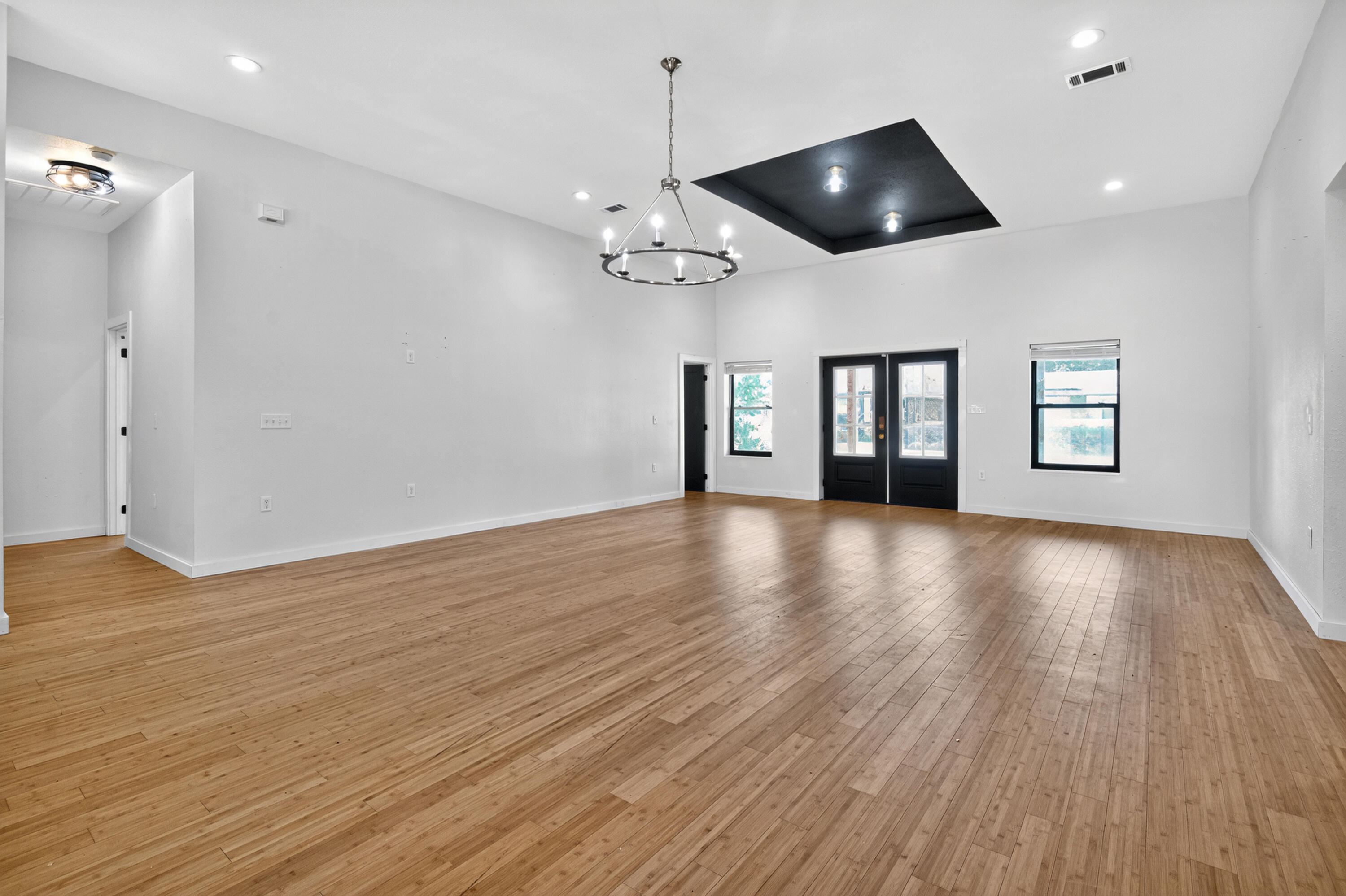 115 Ridgewood Avenue Mary Esther, FL 32569 - Photo 12 of 54 a view of an empty room with wooden floor and a window