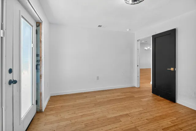 a view of a kitchen with a sink wooden floor and a kitchen