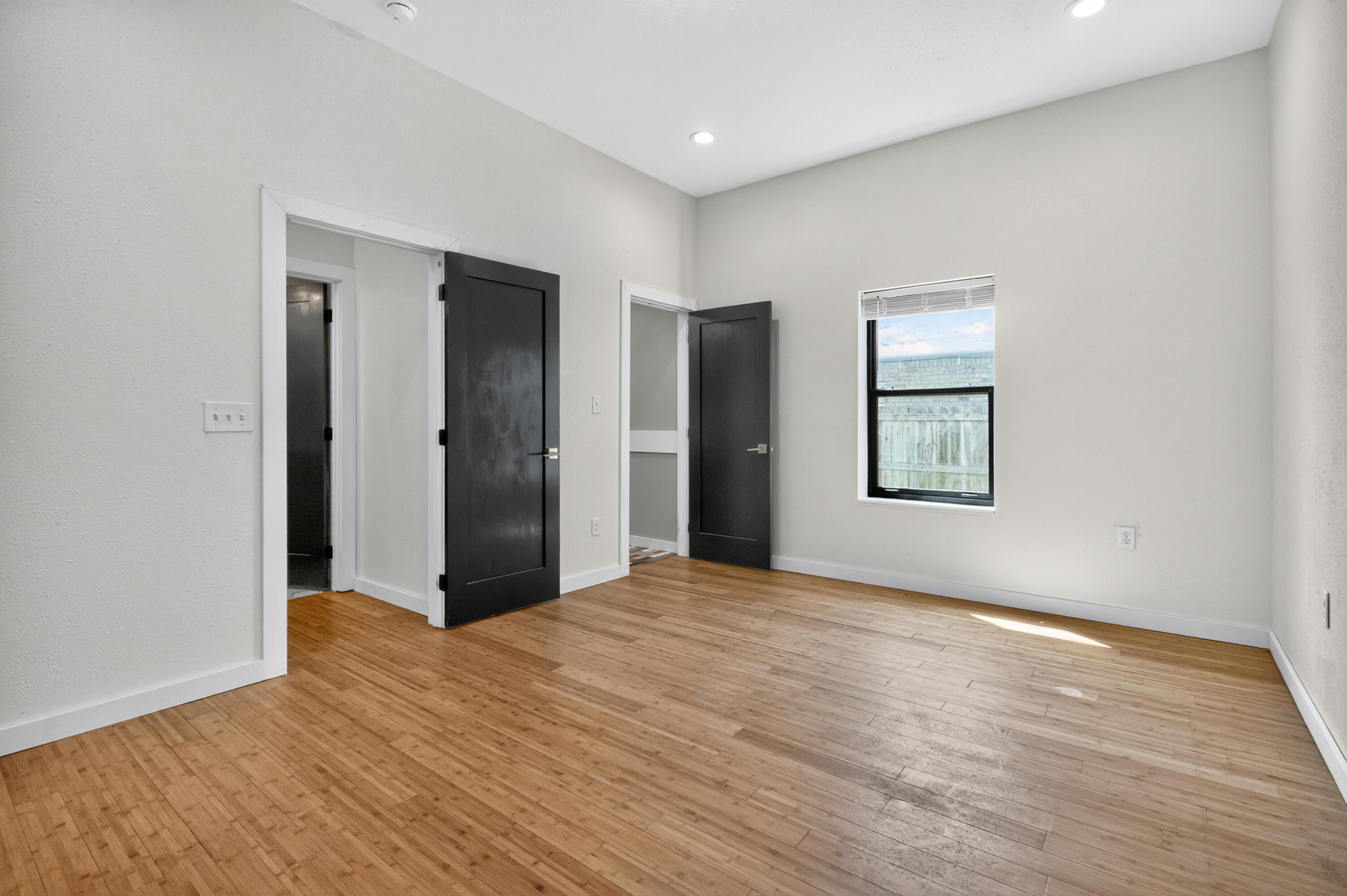 115 Ridgewood Avenue Mary Esther, FL 32569 - Photo 19 of 54 a view of an empty room with window and wooden floor